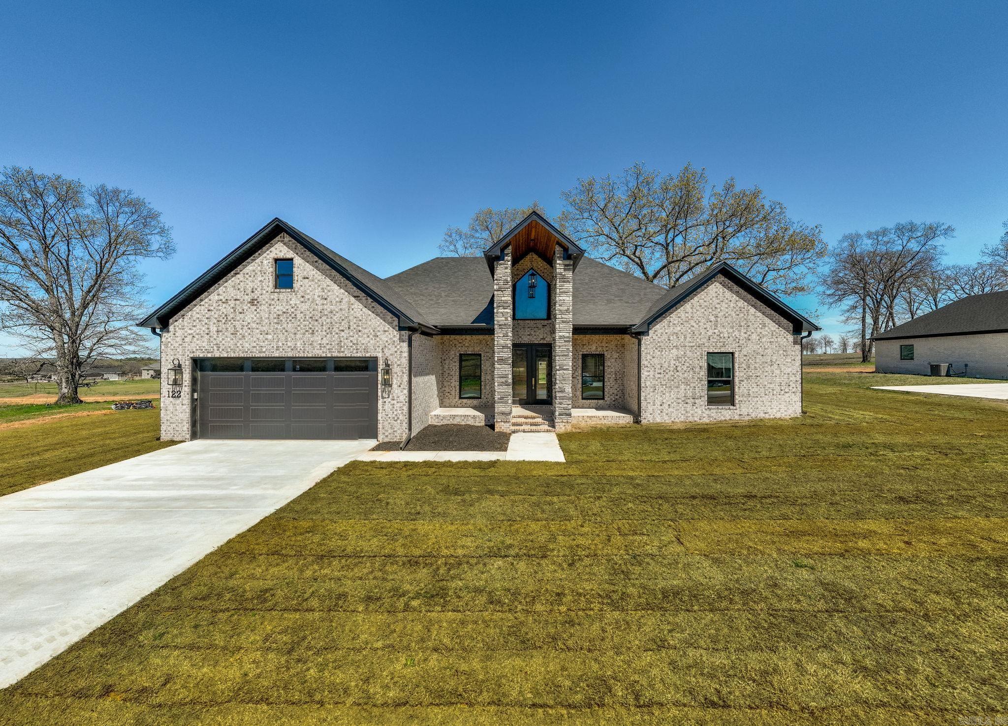 Beautiful new construction home in one of Greenbrier's newest subdivisions. Enjoy high speed fiber internet here! Huge living room with an electric fireplace and built in shelving surrounding the fireplace. The kitchen is a dream with expansive countertops, plenty of cabinets and the amazing hidden pantry. The laundry room joins the primary closet which circles through to the primary bathroom. In the primary bath is a custom tile shower, soaking tub and dual vanities. Lockers located as you come in from the garage with lots of extra storage. Luxury vinyl flooring throughout with granite countertops in kitchen and bathrooms. The back porch is large with great views! Come see this home today!