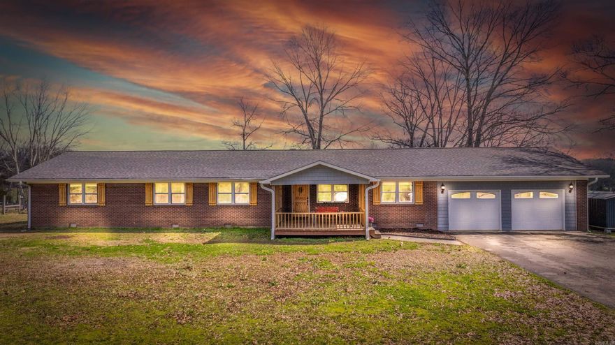 Country Living, City Convenience! Nestled on nearly 3 peaceful acres, this beautiful,renovated home offers 4 bedrooms, office, 2.5 bathrooms & a spacious 2,377 sqft of living space. In 2015, it was taken to the studs & completely updated with NEW plumbing, electrical, HVAC, roof, energy-efficient windows, hand-scraped engineered hardwood flooring, granite counter tops, custom cabinets & more. The spacious open floor plan is perfect for entertaining & features a wood-burning fireplace & gourmet kitchen w/ granite countertops, custom cabinetry and a huge island. Dining area includes a wet bar w/ a beverage fridge. The primary ensuite is a retreat boasting a large walk-in closet, french doors to the back deck & a spa-like bathroom w/ a walk-in tile shower. There are 3 additional bedrooms, office, lg mudroom, utility room, & oversized 2 car garage w/ a 10 x 12 storage room, shop w/ electricity & shed. Located just 1.5 miles from I-40 & Beaverfork Lake Park, you’ll enjoy breathtaking views of farmland, sunrises & wildlife. This property offers serenity & space to enjoy the outdoors, so don’t miss this rare find & schedule a tour today! Agents see remarks.