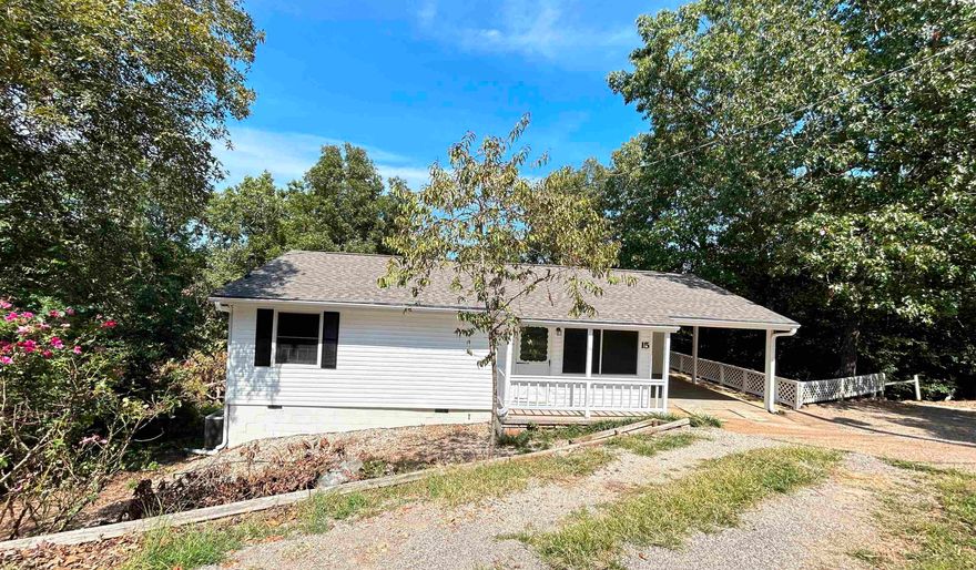 REDUCED!! This well maintained home on 2 lots, has just been remodeled with a new roof, guttering, flooring and paint. HVAC updated in 2015 and Septic in 2022 per seller. New stove and dishwasher. The front yard is mostly gravel for low maintenance.  The back yard is mostly wooded for natural tranquility.  There is a partially finished basement with bonus room, that could be a 3rd bedroom + full bath and unfinished area for added storage and use as a storm shelter. There is a patio on lower level and a multi tiered deck on upper level for relaxing and entertaining. This home is move in ready and features a 1 car carport and a huge mud laundry room. Centrally located in town to 7 lakes and 2-18 hole golf courses. Would make a great weekend or nightly rental.   Enjoy the peace and quiet this area has.