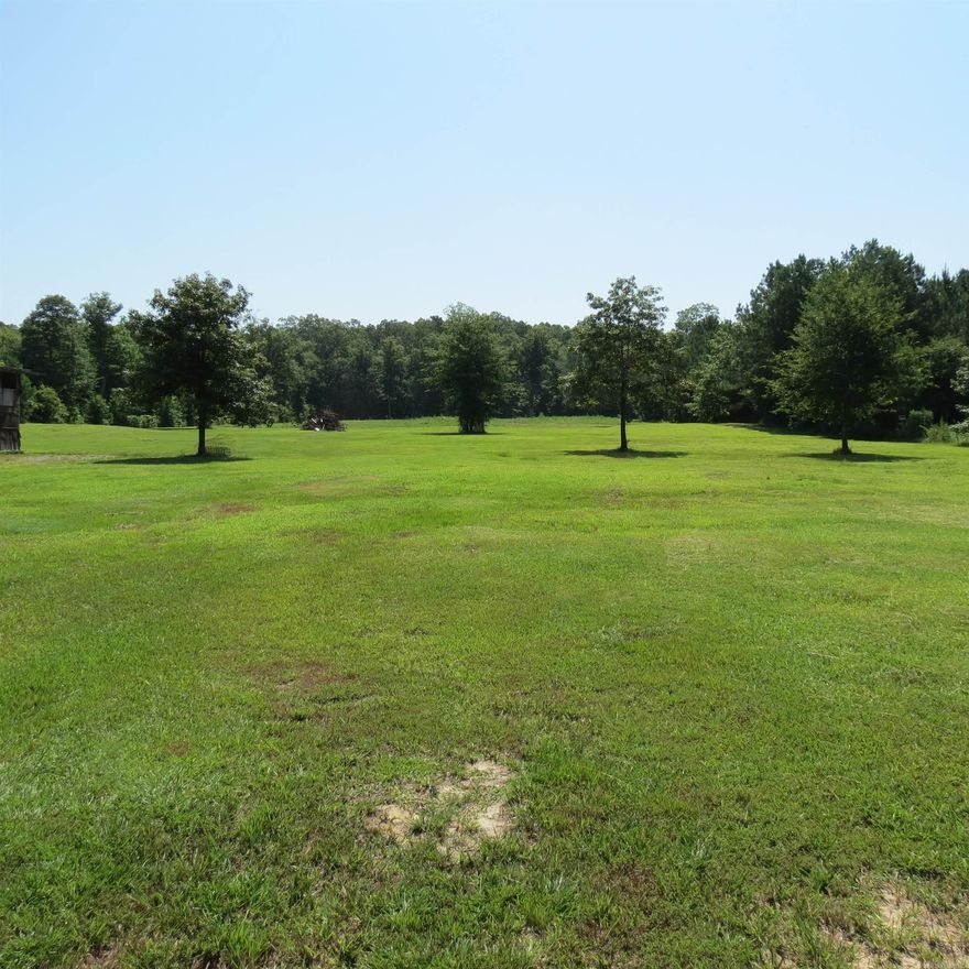 Beautiful piece of land for your new home place. Septic system already in place. Property is improved with 2 concrete slabs one has a shed on it that has had storm damage, the other is open.