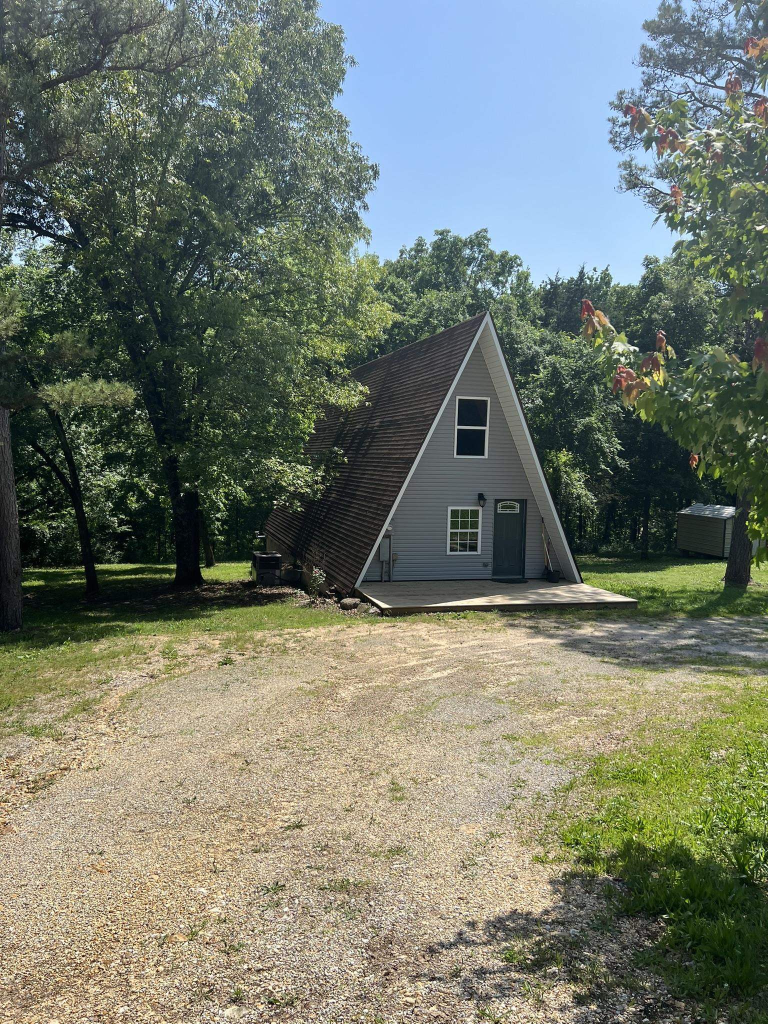 This beautifully updated 2-bedroom, 2-bath A-frame home offers the perfect blend of architectural charm and modern upgrades. Featuring a striking spiral staircase, open-concept living, and a new central heat and air system, this home is move in ready and full of character. Located just 5 miles from Cooper's Hawk Golf Course and 10 miles to the Mount Olive Access to the White River, outdoor enthusiasts will love the easy access to recreation, while still enjoying the convenience of city living. Whether you're looking for a stylish primary residence, vacation home, or investment property, this one-of-a-kind urban retreat checks all of the boxes.