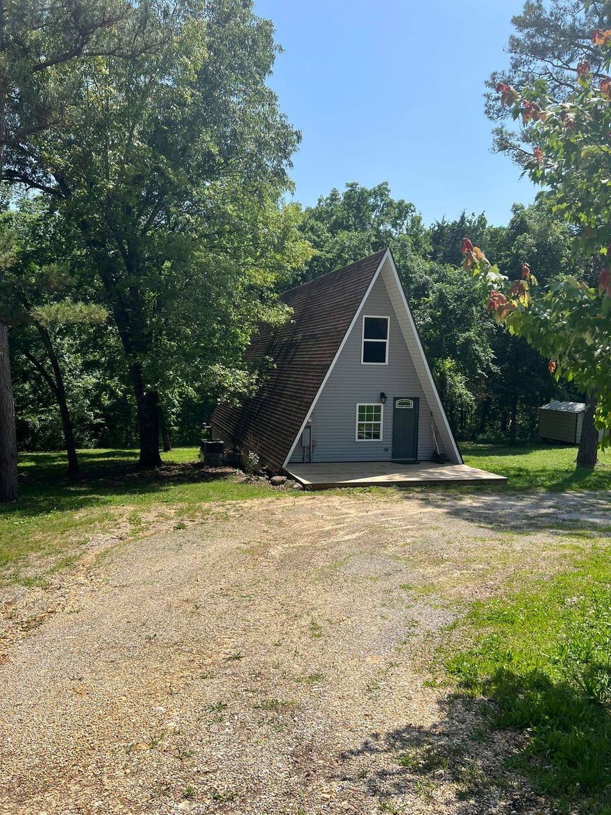 This beautifully updated  2-bedroom, 2-bath A-frame home offers the perfect blend of architectural charm and modern upgrades. Featuring a striking spiral staircase, open-concept living, and a new central heat and air system, this home is move in ready and full of character. Located just 5 miles from Cooper's Hawk Golf Course and 10 miles to the Mount Olive Access to the White River, outdoor enthusiasts will love the easy access to recreation, while still enjoying the convenience of city living.  Whether you're looking for a stylish primary residence, vacation home, or investment property, this one-of-a-kind urban retreat checks all of the boxes.
