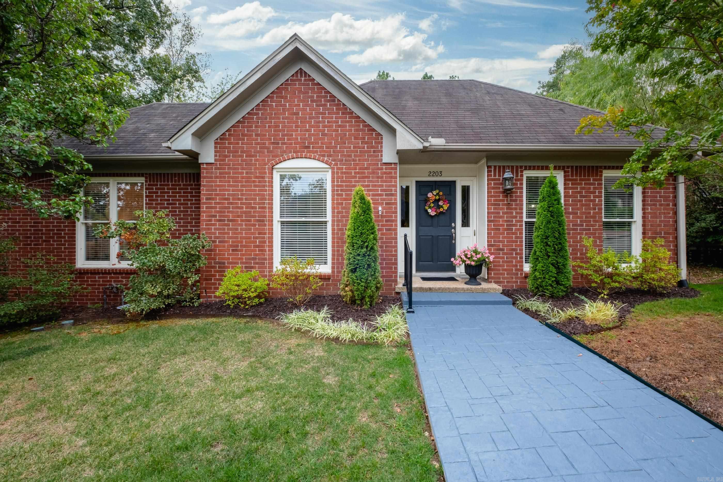 Updated one-level patio home tucked away in the heart of West Little Rock! This move-in ready brick home offers a spacious open layout with stylish updates throughout. The gourmet kitchen features black granite countertops, a quartz island, stainless steel appliances, walk-in pantry and a breakfast area open to the den. The den boasts vaulted ceilings, a wet bar with glass shelving and a beautiful gas-log fireplace. French doors from both the den and primary suite lead to a private courtyard/patio and small fenced backyard. The spacious primary suite is at the back of the home and includes double sinks, vanity area, a jetted tub, walk-in shower and large walk-in closet. The guest bedroom features an en-suite bath. The third bedroom/office offers custom built-ins. Additional highlights include: a formal dining room, beautiful floors, crown molding, tons of windows/natural light, walk-in closets throughout, ample storage, laundry room with sink, a rear-loading two-car garage and more! Perfect for entertaining! Fantastic location close to shopping, dining and more!