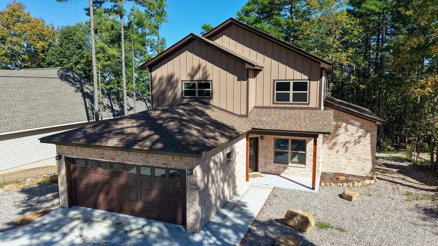 NEW CONSTRUCTION! Price to sell! Step into comfort and style with this beautifully crafted new construction home in the heart of Hot Springs Village. Upon entering the main level, you will be greeted with an open concept living area to the left and a HOME OFFICE to the right of the staircase.  The main-level primary suite is a true retreat, featuring a spacious walk-in closet and a versatile corner nookāperfect as a cozy sitting area or a SECOND HOME OFFICE. The open-concept kitchen makes it easy to stay connected while cooking, dining, or relaxing. Upstairs offers three additional bedrooms, two full bathrooms, and a generous MEDIA ROOM designed for comfort, recreation, and entertaining. The upstairs deck offers a PARTIAL VIEW OF THE LAKE in a distance.  This home offers the perfect blend of function and charm. Come see what makes this property so special, placing you within minutes of golf courses, walking trails, and lakes to enjoy at your leisure.