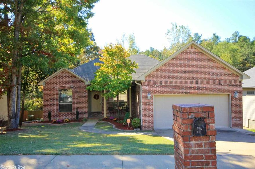 Wonderful One Level in West Little Rock!  Spotless Condition with Bamboo Flooring in all rooms except Kitchen and Baths (tiled).  Fresh, Neutral Paint Throughout.  Updated Light Fixtures.  9 foot Ceilings.  Open Floorplan.  Master Bedroom has Huge Walk in Closet.  New Deck (May 2014) overlooks Wooded Area & Privacy Fenced Yard.  Bricked Front Porch.  Beautiful new Landscaping in Front Yard.  Excellent Street Appeal. New Roof (Oct. 2011). New Oven (Oct. 2014). Quality, charm and great natural light. Perfect!