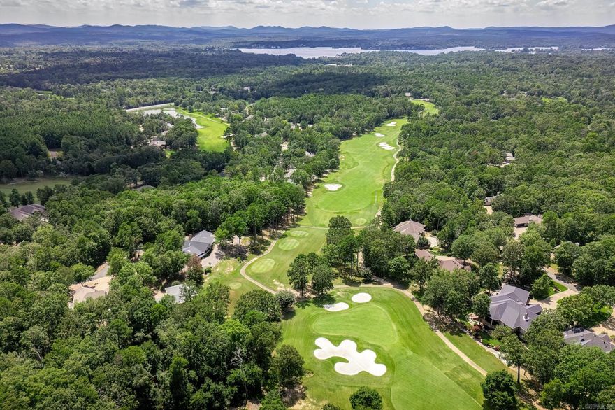 !!!Motivated Seller - Price Improvement!!! Willing to entertain all offers and discuss Incentives!  This stunning home sits on one of the most expansive golf frontage lots in the village, making it a hole-in-one for golf enthusiasts. Positioned on an elevated half-acre lot, every room offers scenic, private views of the meticulously maintained course—so you're never far from the game you love.  The open-concept kitchen and great room create the perfect 19th-hole retreat, with floor-to-ceiling windows that frame breathtaking fairway views. Vaulted 13-foot ceilings, remote-controlled drop-down shades, and an electric log fireplace (convertible to gas) provide a cozy, inviting ambiance. Deep architectural skylights enhance the natural light.  The primary suite is a true escape, featuring direct access to a screened porch where you can sip your morning coffee while analyzing the pin placement. Enjoy world-class golf, tennis, pickleball, a private pool, and an array of dining and social events—all just steps from your door!  Come and enjoy the Country Club Lifestyle!