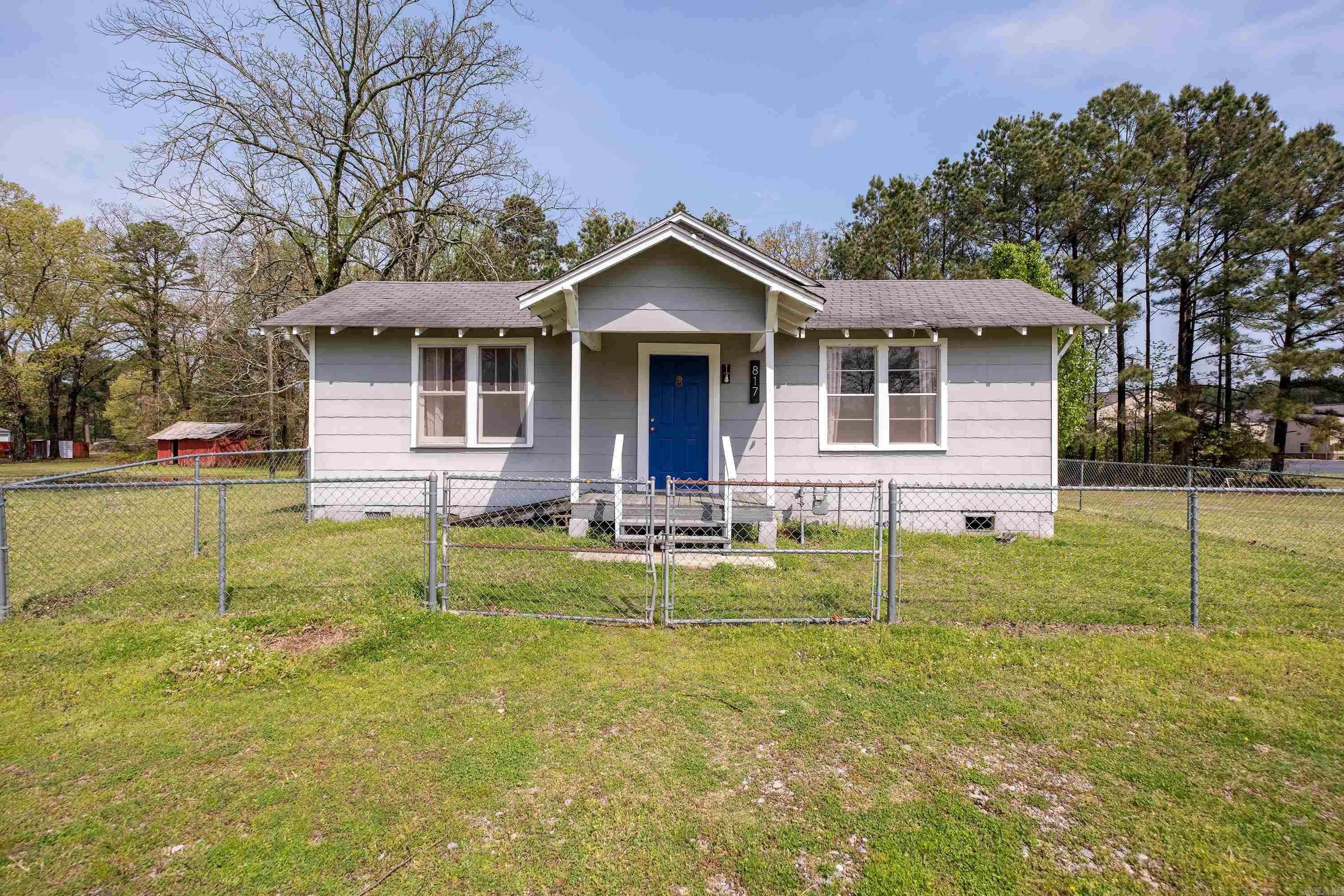 Excellent opportunity for commercial lot and building in Redfield. Large lot with plenty of room for growth. Building features 3 bedrooms, a full bath, living room, sunroom, dining area, and kitchen. Small fenced yard area in front of the building. Accessibility ramp in rear. Covered parking and circle driveway.