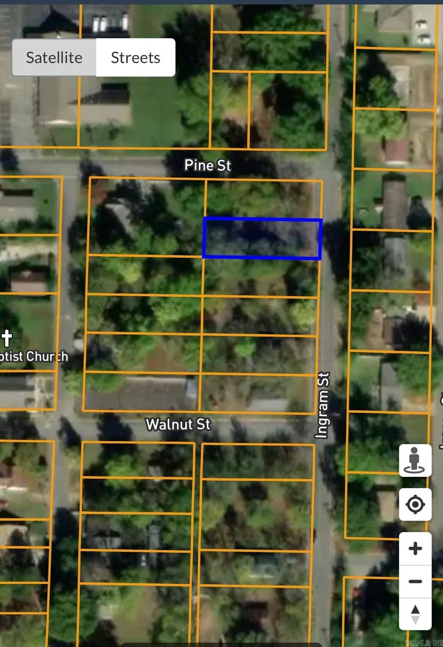 Nice corner lot located in the city limits of Conway Ar. The land has a well-maintained lawn and mature trees.