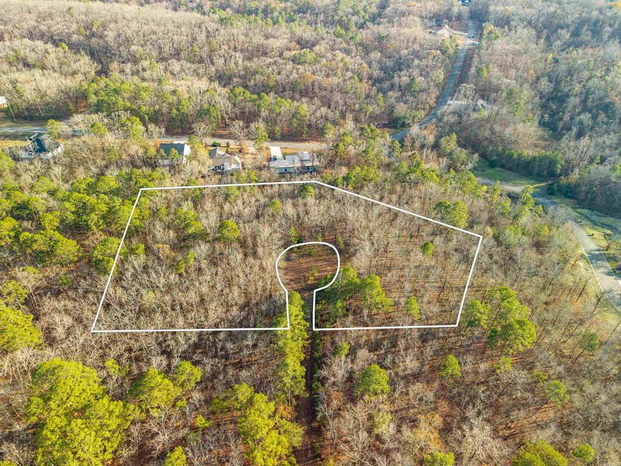 Originally 8 lots now combined into one, this expansive property offers incredible flexibility. Keep the lots together for a generous homesite or divide it however you choose. Nestled among mature trees, the settling provides peaceful wooded surroundings with beautiful vista views, plus a seasonal lake view during the winter months. Located in Diamondhead community of Garland County, you'll enjoy access to amenities including basketball, pickleball and tennis courts, Olympic sized pool, playground, pavilion, a country club, and The 19th Hole bar and restaurant.