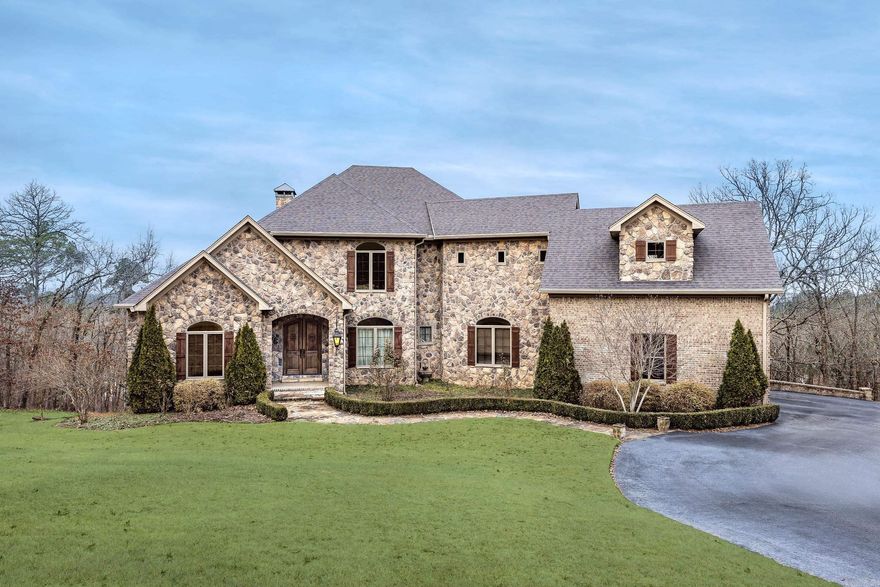 This stunning custom-built estate, featured in Soirée Magazine as one of Little Rock’s most beautiful homes, sits on 5 private cul-de-sac acres with breathtaking views of Pinnacle Mountain. Spanning over 6,700 square feet, this 5-bedroom, 4-bath residence blends luxury and efficiency with geothermal heating and cooling, superior foam insulation, on-demand hot water, and a fire suppression system. Exceptional craftsmanship shines through wood beams, extra-wide solid oak floors, alder vanities and built-ins, custom cabinetry with integrated TV and spice storage, and a rich double-stain finish on moldings and doors. The gourmet kitchen opens to expansive living areas filled with natural light from Pella wood/clad windows. The lower level features polished concrete floors, a bar, wine cellar, bonus spaces, and a separately ducted workshop with added storage and a Fema Safe room.  Outdoor living impresses with stamped concrete patios, screened porch with fireplace, gazebo, vineyard, irrigation, brick-and-rock exterior, cedar accents, and thoughtful details like auto-shades, exterior timer lighting, and a generator plug. Schedule your private showing today.