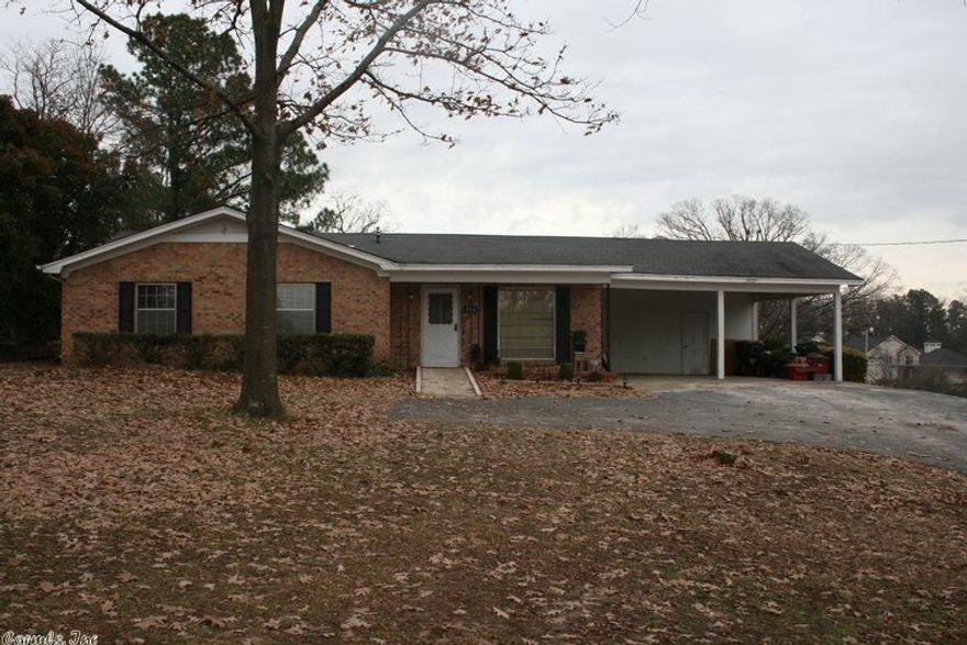 Established three bedroom home within walking distance of ASU. Cozy family room features built-ins, ceiling fan and fireplace. French doors lead to the eat-in kitchen that offers a breakfast bar. There is also a separate living room. The partial basement would be a great storm cellar. Other amenities include laundry room, two car carport, patio overlooking fenced backyard and storage building. This home would be a great investment property! New roof has been put on in 2014.