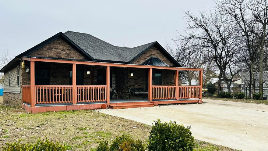 Discover comfortable living in this inviting 4-bedroom, 2-bath home featuring an open floor plan and a cozy stone fireplace that anchors the spacious living area. The kitchen is truly cook-friendly, offering ample workspace and granite countertops that continue into both bathrooms for a polished, cohesive look. Enjoy a very large backyard perfect for gatherings, play, or gardening, plus an outside storage building for tools and extras. The living room TV will also remain with the property, adding even more value. Move-in ready and designed for everyday convenience this one won't last long!