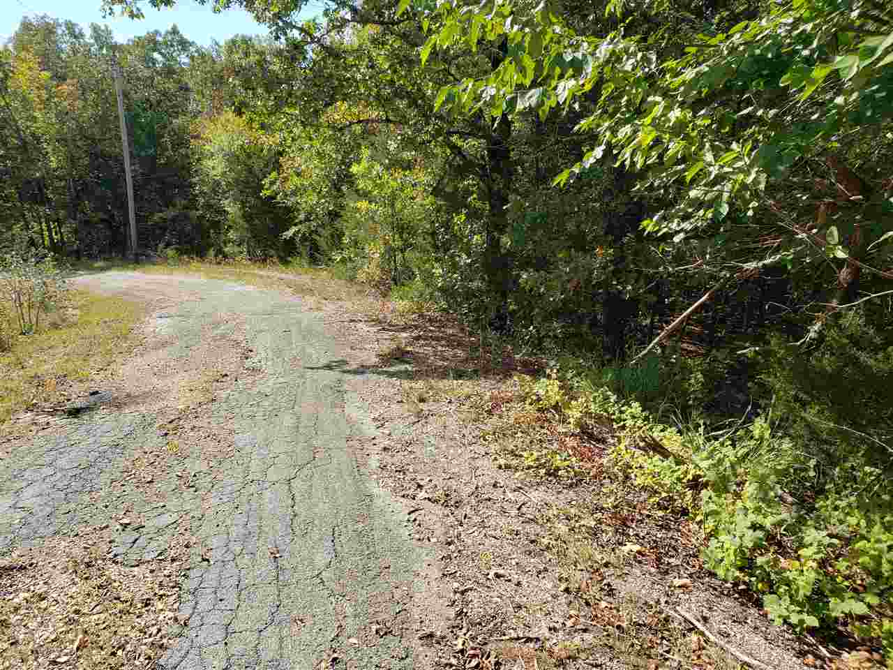2 Lots side by side on a hill side, Over3/4 of an acre of land, sloping down from front to back. Could be an awesome view of the wet weather creek and valley. Nice and secluded. So lots of trees and wildlife in this area. Ownership of these lots comes with all of Cherokee Village amenities. 7 Lakes, 2 Golf courses and the beautiful Southfork River is 3/4 of a mile away as the crow flies. Come see these lots and pick out the spot where you want to build your forever home In Cherokee Village.