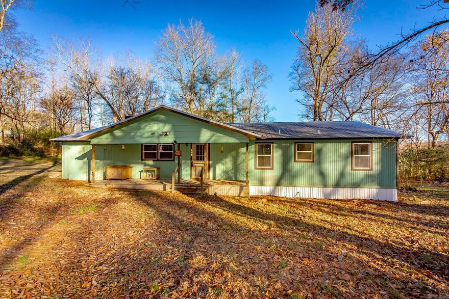 Country living on a quiet street! Welcome to the "Greenhouse". Sitting on a little under an acre and a half in Magnet Cove School District. 15 minutes from Hot Springs. 10 minutes from I30. Unrestricted, out of city limits, and in a USDA Rural Development area so ask your lender about zero down! Boasting a NEW metal roof and a completely NEW HVAC system and duct work! Other recent upgrades include: updated plumbing, new floors in primary bathroom and bedroom, fresh paint throughout, new skirting, back porch, and kitchen cabinets. PS...This is a Jim Walter Site Built Home, not a mobile or manufactured! AGENTS SEE REMARKS