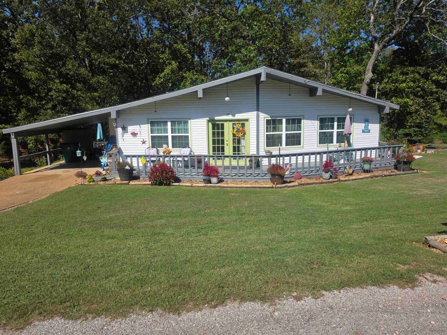 Super cute, updated home sitting on 2 large corner lots. Plenty of room for a garden, or yard for the kiddos to play. This home has been updated over the past 5 years with new flooring, new paint, new kitchen appliances, new roof, new HVAC, new water heater and both bathrooms have been updated as well. There is a wood burning fireplace with an insert. It comes with an outbuilding for extra storage. It has a one car carport with extra parking in the back. It has a full-length front and back deck. With half of the back deck being covered and half open. It's a great place to sit and have morning coffee while watching the local wildlife. This home is located up towards the front of the village, near the schools, churches and the Choctaw Center. Easy access in and out to the 4-lane for shopping, eating and entertainment. Don't forget that Cherokee Village has 7 lakes, 2 golf courses and the Beautiful Southfork River for your enjoyment. Book an appointment to see this wonderful home soon.