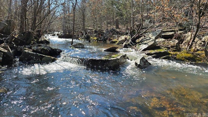 Wow, I mean WOW. Check out this beautiful remote and private tract with an impressive creek. This property is located just ¼ mile off the gravel county road with deeded easement and access to nearby rural water and electricity. The newly built access road is manageable for any 4x4 vehicle and could be upgraded if desired. Entering the land, a small cedar glade blankets a massive bedrock sheet that cascades gently towards a stunning creek that flows over the sheer rock as if it were God’s natural water slide. Meandering through the property, this creek has several large pools and small waterfalls. In sections, the stream just calmly hits stretches of vast and level timber, and it creates a wonderful portrait amongst the trees. A number of large rock outcroppings and short bluff areas overlook a few of the wooded bottoms, and of course, these spots are set off by Clearwater Creek. An immense number of game trails cover several draws, oak flats, and pinch points, and seem to travel back and forth from cedar thickets to open oak stands. Evidence of buck activity is prevalent in the rubs that coat the hillsides.