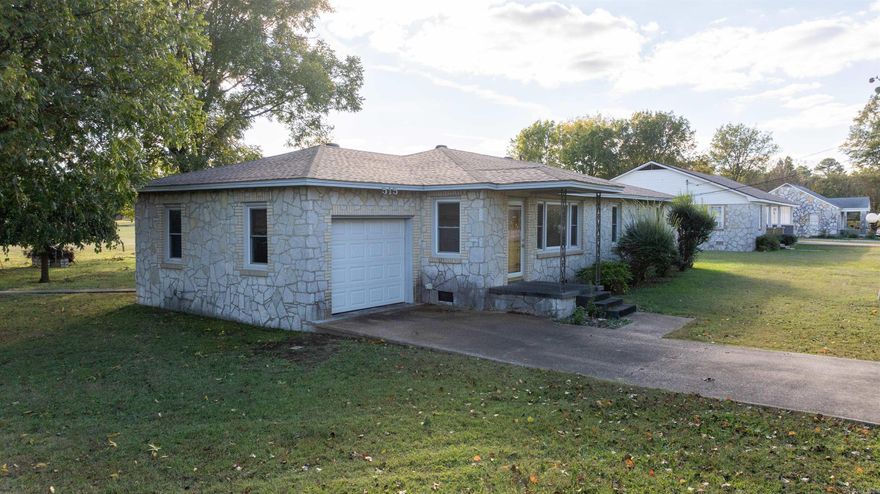 Welcome to 515 East Center Street in Cave City! This three-bedroom, two-bath home sits on approximately one acre and combines small-town convenience with comfortable living. The property includes a spacious detached garage/shop—ideal for storage, hobbies, or a home workspace. Inside, the home features a functional layout with inviting living areas and plenty of natural light. With a few cosmetic updates, this property has great potential to truly shine. Conveniently located just minutes from schools, shopping, and other local amenities, it offers a peaceful setting while remaining close to everything you need. Whether you’re a first-time buyer, or wanting a home with room to grow, this one is worth a look.