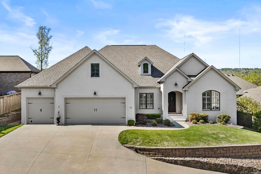 Experience luxury living in the coveted Mirabel Court community of Chenal Valley! Welcome to 21 Mirabel Court, where a charming front porch overlooks lush landscaping and invites you inside through a custom arched door. Once inside, you'll be amazed by the soaring ceilings and abundant natural light throughout. The formal dining area with coffered ceilings flows seamlessly into the spacious living area, featuring a cozy fireplace and built-ins. The chef’s kitchen boasts custom cabinetry, sleek quartz counters, and a double oven, ideal for entertaining. A breakfast nook with a built-in serving area adds to the charm. The owner’s suite offers a spa-like retreat with dual vanities, soaking tub, expansive shower, and a custom closet with built-in dressers. Three additional bedrooms on the main level—one suitable as an office or guest suite—provide ample space. An expansive fifth bedroom upstairs with a private bath can serve as a media room or home gym. Enjoy outdoor living on the oversized covered porch with an outdoor fireplace. Three car oversized garage with added storage and built-ins. Sprinkler system. Enjoy all the amenities Chenal Valley has to offer (pools, parks, ect.)