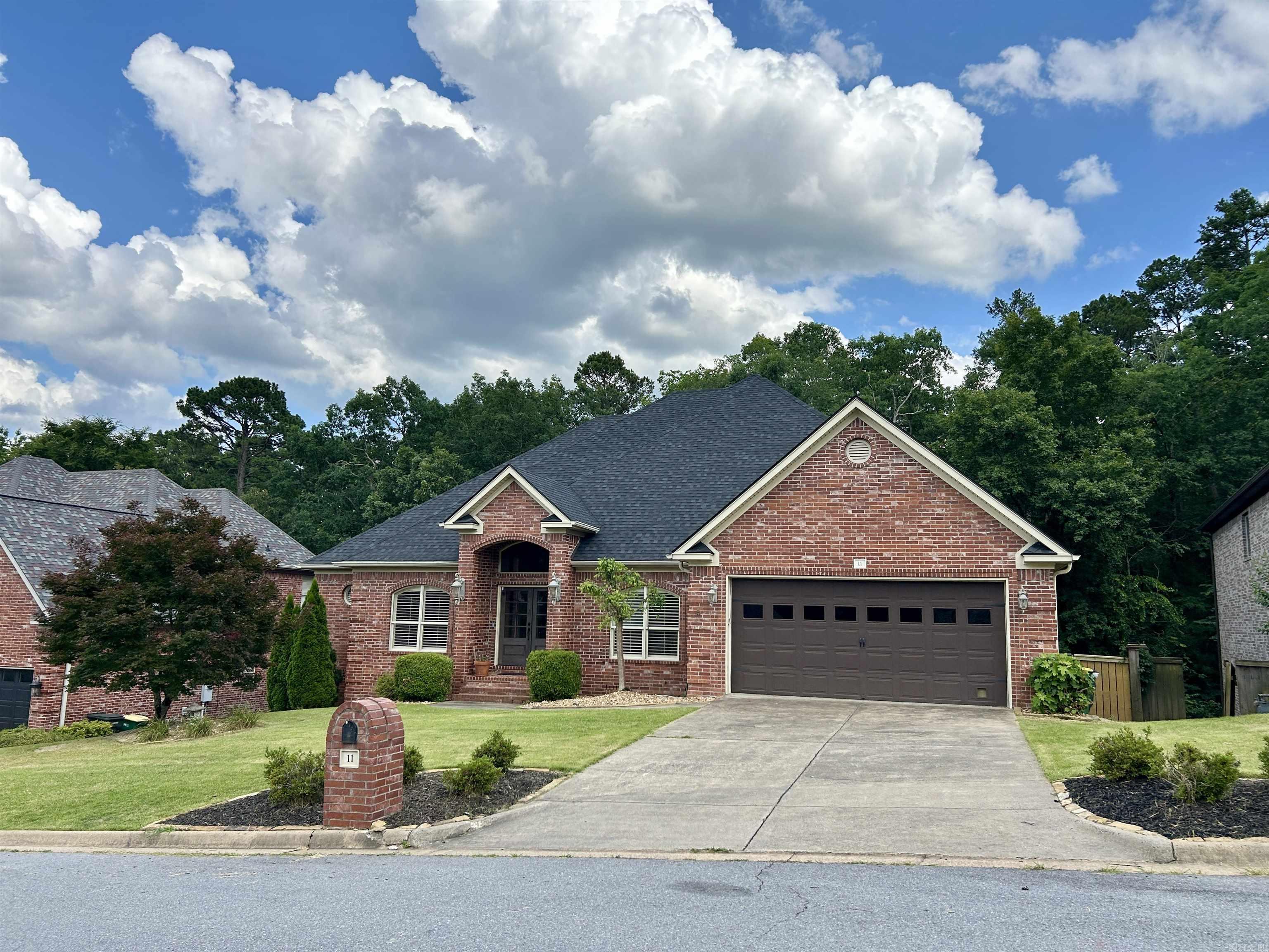 Enjoy all the amenities the Woodlands Edge has to offer here in this beautiful, one level home. This spacious home features hard wood flooring in an open floor plan with an eat-in kitchen, formal dining room and an office that could be a fourth bedroom. The open kitchen features cabinets and counter space galore! with an island, breakfast bar, gas range, double oven, walk-in pantry and a walk thru butler's pantry going into the dining room. The primary suite is apart from the guest rooms. The guest rooms are a comfortable size with walk-in closets and share a bathroom. The third bathroom opens to the office from the hall. Enjoy privacy and nature with the outdoor living space - covered deck looking out over the woods. BRAND NEW ROOF 2025! HVAC 2019. Extra features that you expect in a great home include plantation shutters, faux blinds, built-ins, fenced yard, lawn sprinklers.