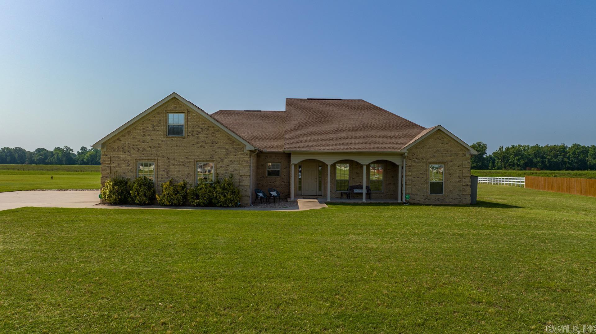 Stunning on Smarty Jones! Welcome to your retreat from the city that is just minutes away! This executive home was custom built with energy efficiency in mind, as well as entertaining. The open concept living space allows for easy flow between the kitchen, dining room, and the main living space. Working from home at your equestrian retreat is a breeze in the bonus room that could be either a fourth bedroom, office, game room, or movie room! Have plenty of items that need to be stored? The storage in this house is purposeful and plenty, with closets galore along with ample attic storage. The covered patio and front porch make ideal locations for morning reflection and coffee as well as afternoon or evening cocktail hours with friends! This home is truly a must see, the gated community with its equestrian features are an added bonus! Don't miss the whole home water filtration system that conveys with the property!