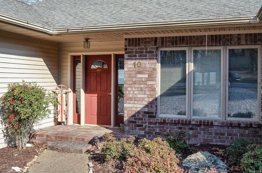 What a view.....This 3 bedroom 2 bath home offers a beautiful mountain view. Custom built with split bedroom floor plan, fireplace and wonderful screened porch. Eat-in kitchen with oodles of cabinets for storage. Double garage with more storage. There is a nice room below the home perfect for workshop or even more storage. Convenient location a few miles from the West gate entrance close to Highway 7 shopping. Hot Springs Village Property Owner Association has a new member buy-in fee of $2,000.00 due and collected at closing.