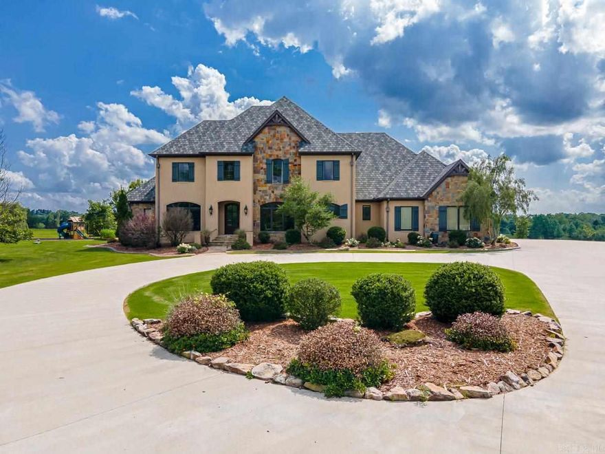 This stunning 5 Bedroom 5.5 Bath home sits on 12 acres with a pond and outdoor kitchen with fireplace and pool. Home offers tall ceilings, gourmet kitchen, large master suit on main level, office, large dining room, hearth room. The upstairs offers 3 bedrooms with a large bonus room that could be a 4 bedroom upstairs and 3 bathrooms. Storage Everywhere! Beautiful landscaping with sprinkler system and 3 car garage and so much more!