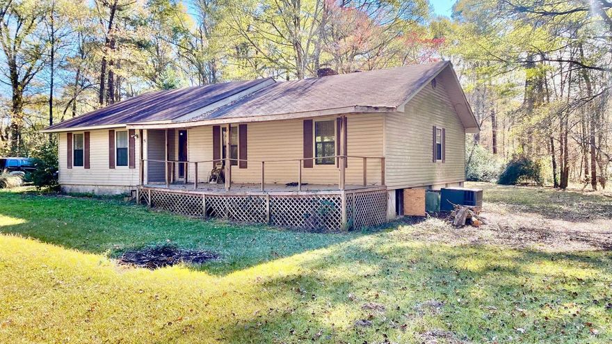 This charming 3-bedroom, 2-bathroom country home features a 20x20 shop, a double-car garage, and is set on 1.7 acres of land. The yard is adorned with large trees that provide ample shade. Inside, you'll find a cozy wood-burning fireplace in the living room, complemented by tall, vaulted ceilings. Each bedroom is generously sized and offers plenty of closet space. While this home needs a bit of TLC, it has the potential to become a wonderful family residence for many years. Contact us today to experience this opportunity in person! Please note, only cash purchase or equivalent. Will not qualify for FHA or Rural Development financing.