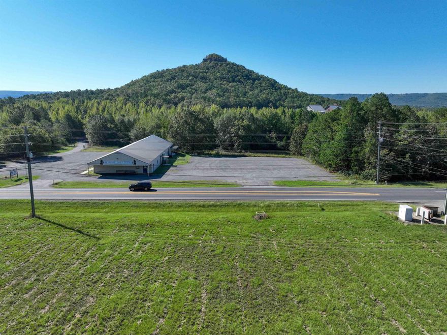 Approximately 2 acres of prime, cleared commercial land on Hwy 110 E—directly across from the Sugarloaf Dance Hall and Sugarloaf Mountain Trailhead, and just steps from the ASU–Beebe Heber Springs campus. This property offers approx. 372± ft of highway frontage with excellent visibility and views of Sugarloaf Mountain. Located in a rapidly developing commercial corridor, this site is ideal for retail, office, service, or mixed-use development. Utilities available at the road include water, electric, and fiber-optic internet. Centrally positioned with easy access to the Little Red River and Greers Ferry Lake. A strong opportunity for investors or businesses looking to build in a high-traffic, high-growth area.