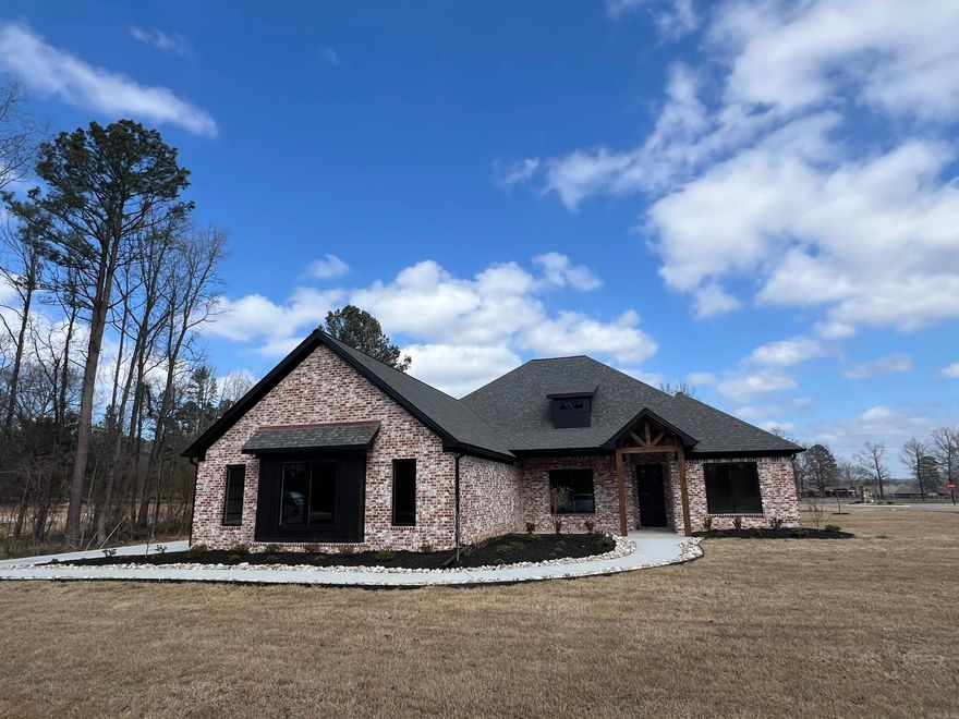 Beautiful new construction home on 1.09 acres. This home has lots of extras including Andersen windows, Delta plumbing fixtures, Bosch 800 series Double oven and 36 inch gas cooktop, Pot-Filler, Tankless water heater, spray foam insulation,  High efficiency HVAC, Double shower in master bath, additional washer/dryer hook up in master closet and oversized 3 car garage. It has 4 bedrooms with 3 full baths and larger separate office. Living room has 2 beautiful stained beams with stained floating shelves above custom built in's on either side of gas fireplace featuring floor to ceiling brick and a gorgeous hearth. Custom trimmed closets with lot of storage! Builder has supplied Bosch refrigerator to match other appliances. Place for extra fridge/freezer in pantry plus countertop for all those small appliances! This house is a must see!