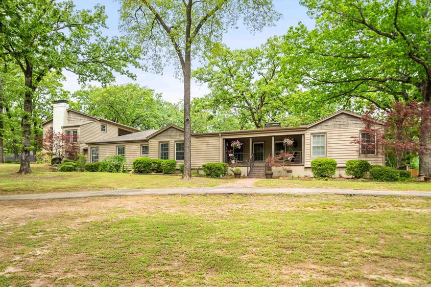 Unique opportunity to call this Bellaire Beauty your own!  This gorgeous classic boasts just under 5,000 sq. ft. on just over 2 acres nestled in the corner of one of Lakeside School District's most desirably close and convenient neighborhoods. Currently used as triple ensuites, but with a total of 5 bedrooms you have the ability to customize your experience to your necessities or heart's desire! The main level boasts 2 living areas, one with a fireplace and a total of 4 bedrooms plus a sunroom that are updated and pristinely maintained while preserving the character and history of the home.  Spacious kitchen den/combo with oversized gorgeous granite island.  Subzero refrigerator, gas range and double pantry with ice maker connection.  Upstairs is a beautifully done guest quarters above the 2 car garage with a woodburning fireplace with gas starter, kitchenette, and balcony overlooking the gorgeous grounds. The back yard is fully & newly privacy fenced, rear gated entry. Expansive wrap-around patio with a gorgeous outdoor fireplace and fountain area.  The outdoor kitchen, hot tub/spa, playhouse and trampoline provide plenty of activities and space for all ages to enjoy.  Call today!