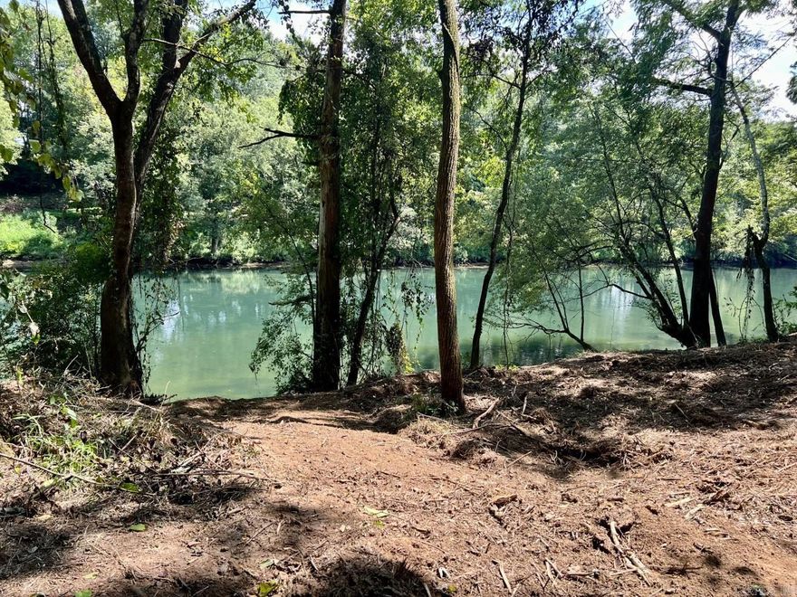 A breathtaking building lot located on the Gorgeous Little Red River.  Large 4 acre +/- lot with approximately 396.55 +/- feet of river frontage.  The land has been mulched and is easy to see & to walk to the river.  Located in the newly developed River Creek Estates Subdivision. No mobiles, utilities available, minimum sf is 1200 and some lots have a set back due to the regulatory flood way.  Water and Electric are at the road.  Mineral rights do not convey