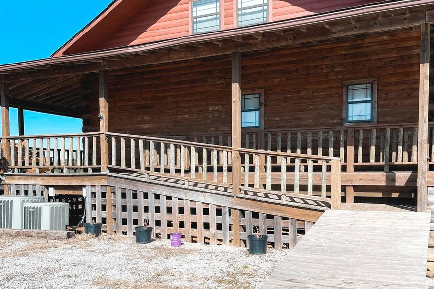 Escape to your own private Ozarks retreat on 52 more or less acres with the option to purchase an additional 15 acres! This updated 4-bed, 2-bath log home offers peaceful seclusion, panoramic mountain views, and unmatched potential. Whether you're dreaming of a homestead, hunting retreat, Airbnb getaway, or future wedding venue, this home delivers.   You’ll find a warm, inviting interior with spa-style showers, abundant natural light from tons of windows, and a spacious wrap-around porch to enjoy the stunning views in every direction. The home also features a full, partially finished walk-out basement, perfect for expanding living space or creating a guest suite.  The land is fenced and cross-fenced, features fruit trees, blackberries, raspberries, raised garden beds, and a spring fed pond. A 2,700 sq ft shop with electricity provides ample space for equipment, hobbies, or future projects. There is also a deep well with a newer pump as well as a 1000-gallon propane tank.