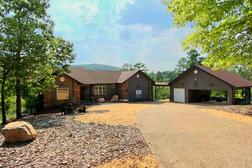 Beautiful 5 acre lot with 3 bedroom, 2.5 bath home.  Entire interior repainted.  Added laundry room main floor.  Totally remodeled owners suite to include 2 closets, redesigned open kitchen/dining floor plan updated with granite counters, PLUS hardwood floors ALL in 2012.  Multiple decks overlook vista views of mountains.  Lower level includes 2 guest rooms with additional living area and private deck.  Low maintenance landscaping creates the perfect get-away destination.  Better hurry!