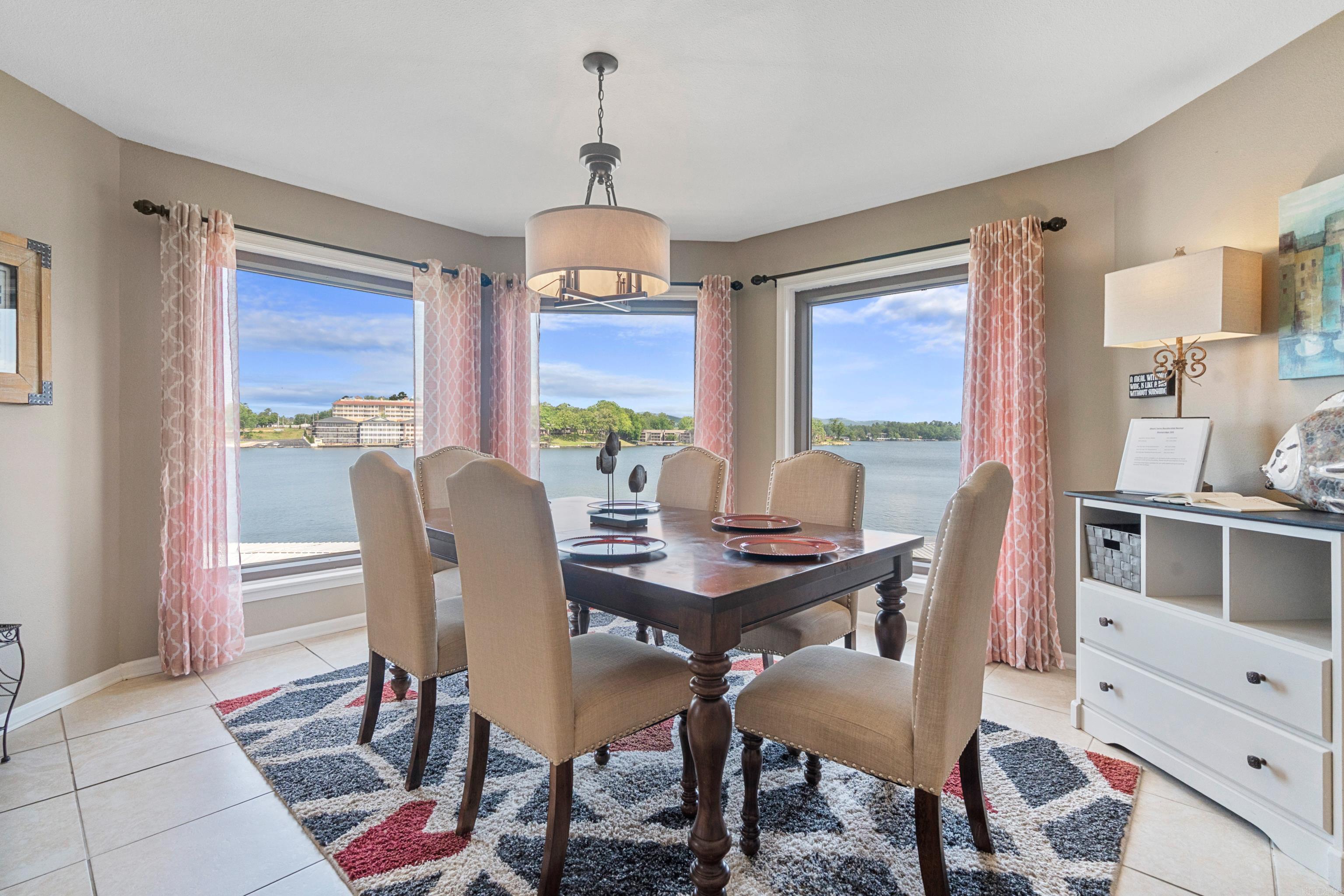 Convenient location by car or boat to this fully furnished two bedroom 2 bath condo with panoramic wide open views of Lake Hamilton and a covered boat slip! Stoneridge is a gated complex with tennis court, pool and hot tub. Great investment property that is ready to go. Nightly rentals are allowed. Call Judy Hanson for gate and door code 501-282-0655.