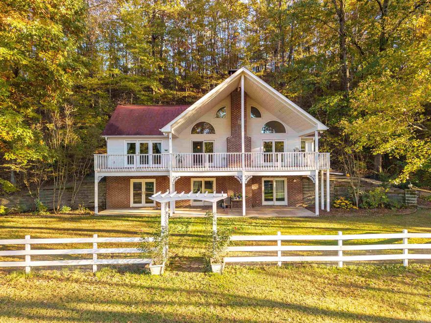 Welcome to 175 Appaloosa Trail, Hot Springs National Park, AR – priced to sell at $575,000!  Discover country charm in this beautifully maintained 3-bed, 2-bath ranch on 13 private acres. Enjoy a 2-car garage with loft storage, 4-stall barn with tack room and chicken coop, 6 acres of fenced pasture, fenced garden, greenhouse, and above-ground pool. The property features gated entry, a private fishing lake, and friendly neighbors. Recent updates include HVAC, water treatment system, pool, new well pump, and updated plumbing fixtures. Inside, the open floor plan offers wood floors, vaulted ceilings, and a wood-burning fireplace. The dining area, bright with windows and French doors, flows into a kitchen with stainless steel appliances (2023 dishwasher, 2024 microwave) and a large pantry.  The primary suite includes a walk-in closet, vaulted ceiling, deck access, and remodeled bath with soaking tub. Downstairs offers two bedrooms with walk-in closets, a family room, full bath, and laundry. Relax on the covered front deck or screened back porch, surrounded by peaceful woods, deer, and starry skies.  Schedule a showing today and get ready to call this beautiful property home!