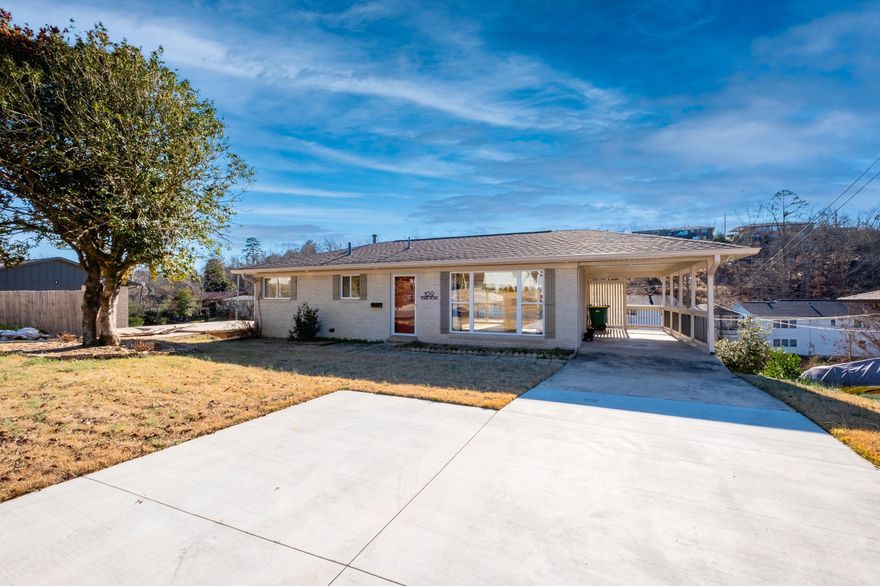 Better than new with inviting curb appeal in coveted Kingwood Place! This 3 bed/2 bath home has been redone and is waiting for its new owner! New roof structure & roof, HVAC equipment & compressor, electrical, sheetrock & insulation, lighting/light fixtures, and all cast-iron pipes under the slab on grade on lower level. Newer windows/doors and water heater 2017. Main level has two bedrooms, remodeled full bath w/ tile shower/bath combo, and original refinished hardwood flooring. Kitchen has stainless appliances, newer built-in microwave, brand new stovetop and oven, eat-in area and breakfast bar, open concept living room with tons of gorgeous natural light and large windows! Large deck off main level overlooks large backyard. Downstairs is a second living area w/ pretty, light oak laminate flooring, bedroom w/ en-suite bathroom w/ new tile, and 235 sqft laundry/utility room and workshop with built-in benches/peg board (space is heated/cooled, not included in sqft). Outside lower level greets you with a flagstone patio leading to backyard. Washer and dryer to convey. One-car carport w/ newly poured extra parking pad. Do not miss this one!