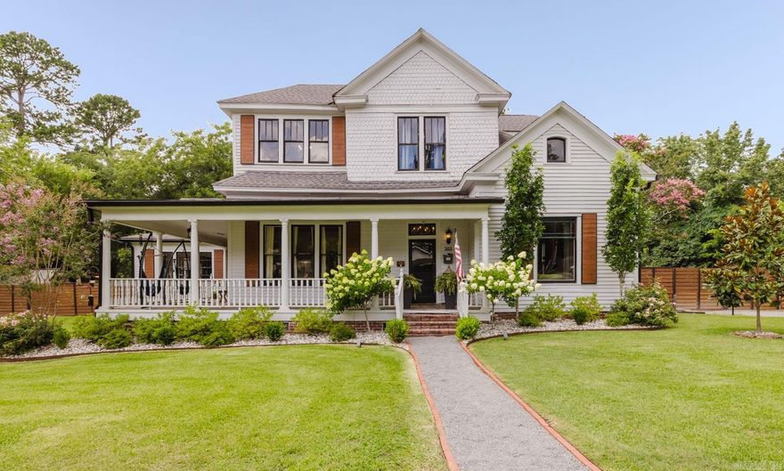 The Bennett House - Listed on the National Register of Historic Places, this stunning Folk Victorian home was built in 1904. 1.36 acres with a garage, shop, & garden! 5 bedrooms, 2.5 bathrooms, a bonus and so much more! Grant eligible for additional updates if desired. Brand New Mini-splits upstairs! Historic features include the original front door, hardware, stained glass window, wood fish scale siding, wraparound porch, single hung and transom windows, original doors, knobs, staircase, flooring, a brick flu, cast iron sinks and bath tubs. Modern improvements include a fully remodeled kitchen and bathrooms, updated plumbing and electrical, spray foam-insulated attic, moisture barrier with fans & dehumidifiers in crawl space, Central HVAC upstairs, tankless water heater, lighting, sprinkler system, privacy fence, fresh paint, a grand 400-lb cast iron chandelier in the entry and a newly added fireplace. A Guide Book with the home’s rich history and full list of improvements is available on-site and in the documents section for agents. Don’t miss your chance to own this beautifully preserved and enhanced historic gem—The Bennett House is truly one-of-a-kind!