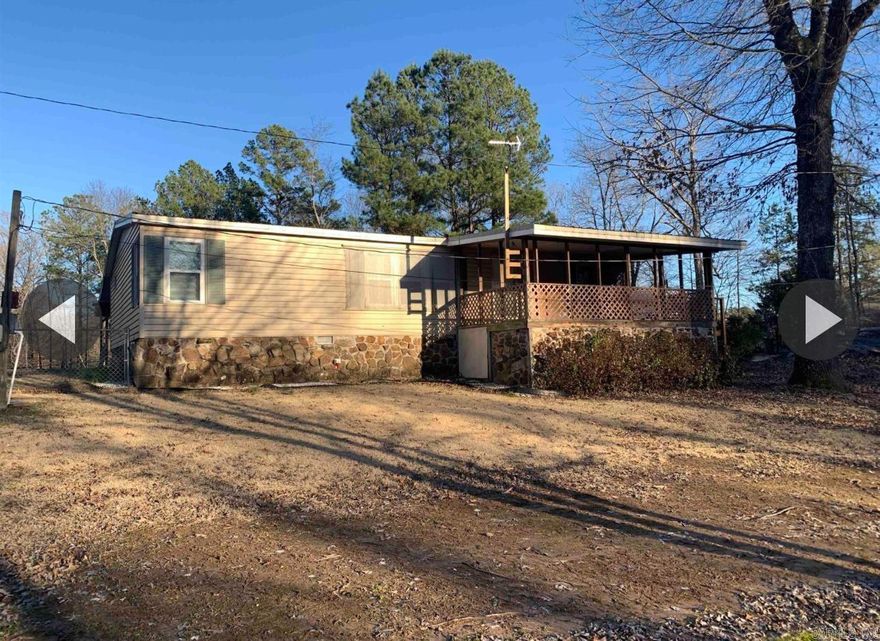 This 3 Bedroom / 2 Bath Home would be perfect with Big Deck in front and Back, fenced in Backyard, Big Work Shop, Carport and Storm Shelter. Both bathrooms were professionally updated in 2022 with new showers and toilets. Insulated windows in 2015. Come and take a look.
