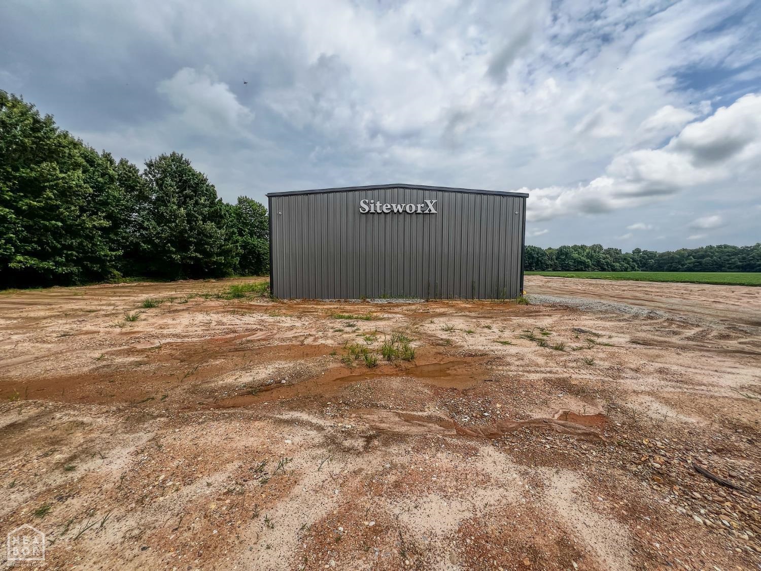 Own a versatile 9,000 SF shop on 5.22 acresāideal for commercial or industrial use. This modern facility offers space, functionality, and room to grow. Highlights include 16-ft ceilings, ten 14x16-ft bay doors for easy access, two private offices, two conference rooms, a break room with laundry, and two full bathrooms. Three on-site junction boxes provide ample electrical capacity for future expansion. The large lot allows for parking, storage, or additional development (subject to zoning). Perfect for manufacturing, auto/equipment repair, warehousing, logistics, contractor use, or specialty businesses like RV/boat storage, fitness centers, or event venues. With infrastructure in place and modern amenities, this property is ready for immediate use or future investment. A rare opportunity for businesses seeking flexibility and scalabilityāschedule a tour today!