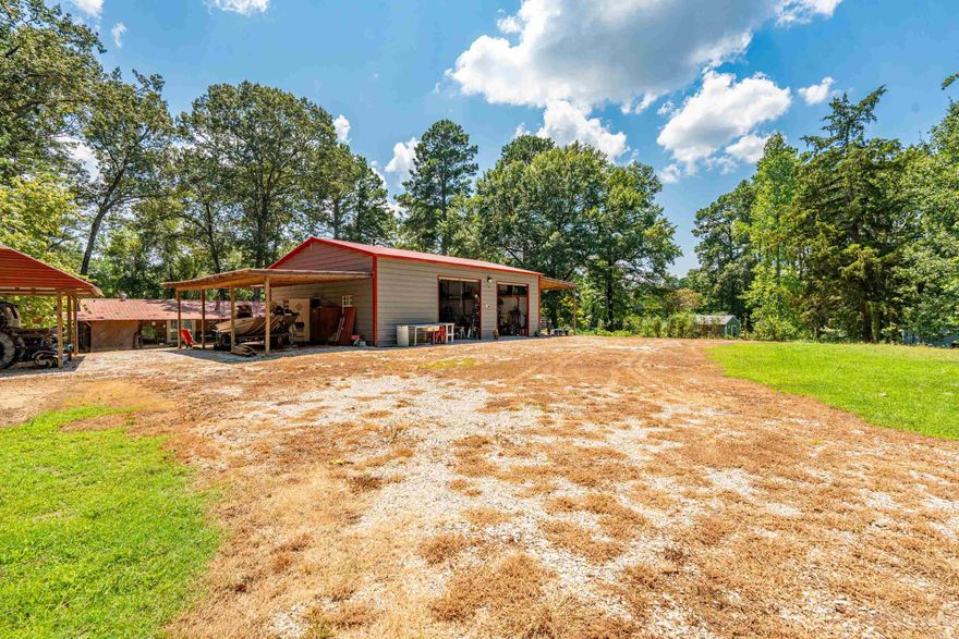 This property is a great Lake DeGray get away or a forever home!  Sitting on two lots, it hosts a 1,568 sq foot 3-bedroom 2 bathroom double wide home with attach front and back porches, a 30 X 40 metal shop with electric, storage building and multiple other side-sheds. Great property and at a great price! Call today for a showing.