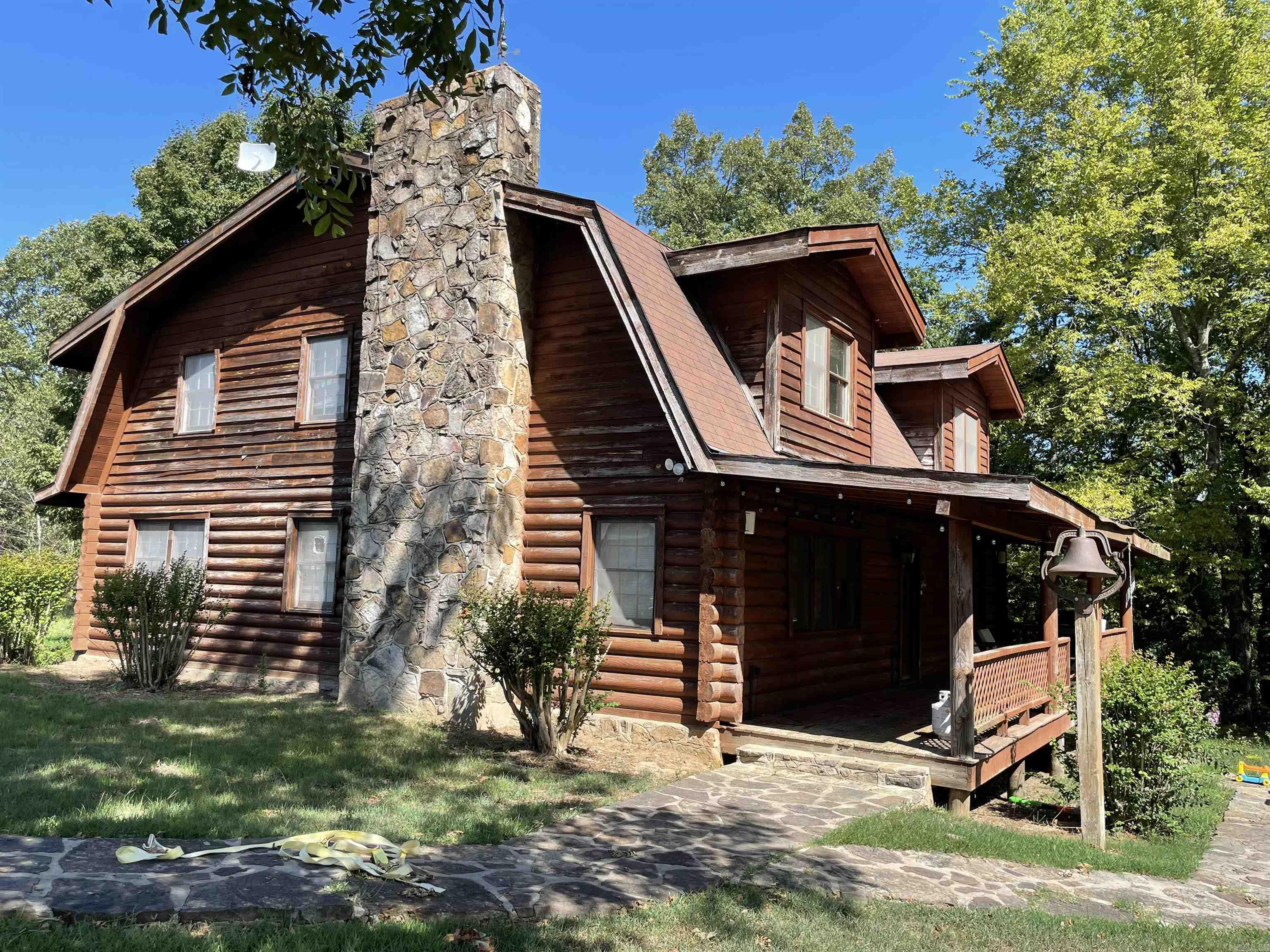 Two homes (log home 2,640 sq ft) (rock home 2,246 sq ft) 50 acres +/-. This was an active Cattle farm with all necessary equipment to do everyday chores. Health issues is the reason for this SALE!!! Large shop is insulated w/concrete floor. All equipment will convey, loading pens, lots of extra pens, spare gates, fuel tank (200 gal) ect. Both homes have wood burning fire places.
