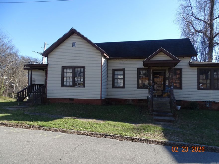 Check out this duplex.  One side is rented.  This house needs work.  It's on a corner lot.