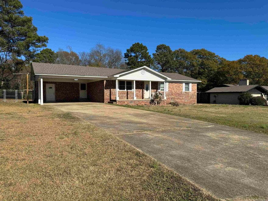 WOW  What an adorable home.  This home was completely remodeled recently.  It offers an open floor plan with lots of natural lighting.   Carpets in bedroom look great and recently cleaned.  Separate laundry room off kitchen with large closet.  Tub showers in both baths.   Kitchen has tile Countertops as well and time back splash.  All neutral colors throughout the home and upgraded laminate flooring in living, dining and Kitchen,  Tile in Laundry and baths and carpet in bedrooms only.   Outside offers a LARGE fenced backyard. Tax amount does include the homestead amount of 425.  This is a must see.   AGENTS SEE AGENT REMARKS PRIOR TO WRITING AN OFFER