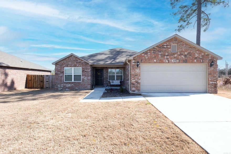 Back on market due to buyer's financing. Welcome Home to comfort and privacy. This spacious and charming all brick home offers 3 generously sized bedrooms and 2 full baths. The luxury vinyl floors throughout the common areas offer durability and ease of maintenance. Enjoy the convenience of a level lot. The fully fenced yard provides a secure space for outdoor activities. The kitchen is perfect for both daily living and entertaining, featuring an eat-in dining area and a breakfast bar that’s ideal for guests. Relax on the covered front patio, perfect for enjoying the outdoors and make use of the 2-car garage for added convenience. This lovely home is move in ready, making it a must-see! Call it yours today! Agents see remarks.