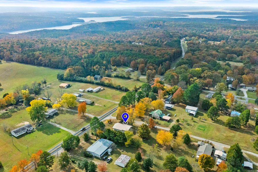 Welcome to 4 Persimmon Lane in Tumbling Shoals. This charming split-level home offers a comfortable layout and peaceful setting just Minutes away from Greers Ferry Lake!! Enjoy peace of mind with a metal roof, storm shelter and multiple outbuildings- perfect for extra storage, hobbies or lake gear. Whether you're looking for a full-time residence or a relaxing weekend getaway, this property offers the perfect blend of comfort, functionality, and lake life living!