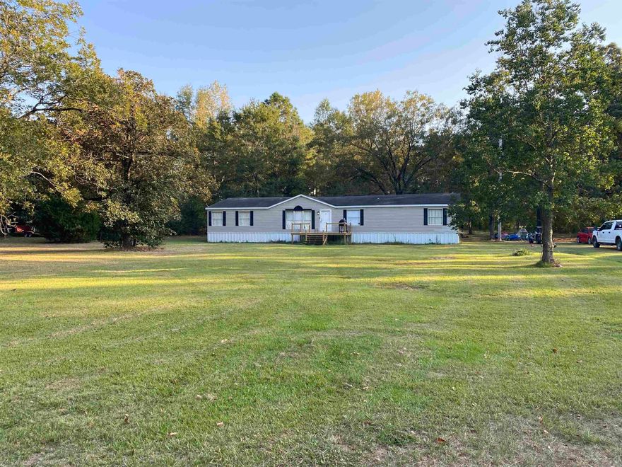 4 Bedroom, 2 Bath, 2,432 sqft home on 3.33 acres located outside of city limits. Two living areas. Kitchen with hidden walk-in pantry. It wouldn't take much to finish out this property and have a great home to live, relax, play and gather! Electric HWH 2022.
