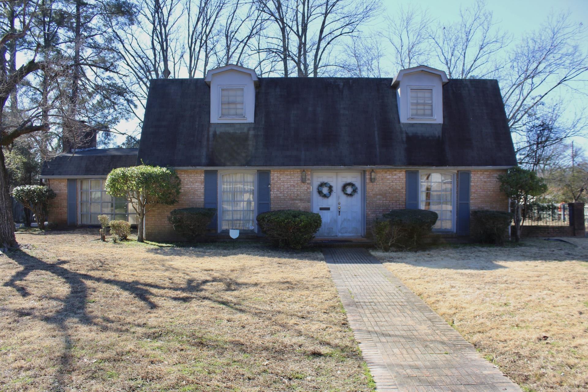 There is so much space in this house! There is a Large living room/den with lots of built in book shelves and brick fireplace. The kitchen has a breakfast area and there is also a formal dining room and formal living room. One bedroom downstairs and one bath and three bedrooms up with two bathrooms. Fully fenced with a spacious backyard. The covered carport parking is in the back. There is also plenty of outside storage off the carport. If you are looking for a large home to make your own, this is the one! The neighborhood is so lovely and well kept. AGENT SEE REMARKS!