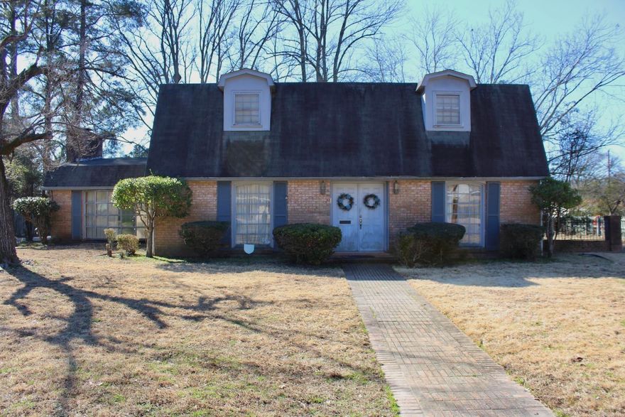 There is so much space in this house!  There is a Large living room/den with lots of built in book shelves and brick fireplace.  The kitchen has a breakfast area and there is also a formal dining room and formal living room.  One bedroom downstairs and one bath and three bedrooms up with two bathrooms.  Fully fenced with a spacious backyard.  The covered carport parking is in the back.  There is also plenty of outside storage off the carport.  If you are looking for a large home to make your own, this is the one!  The neighborhood is so lovely and well kept. AGENT SEE REMARKS!