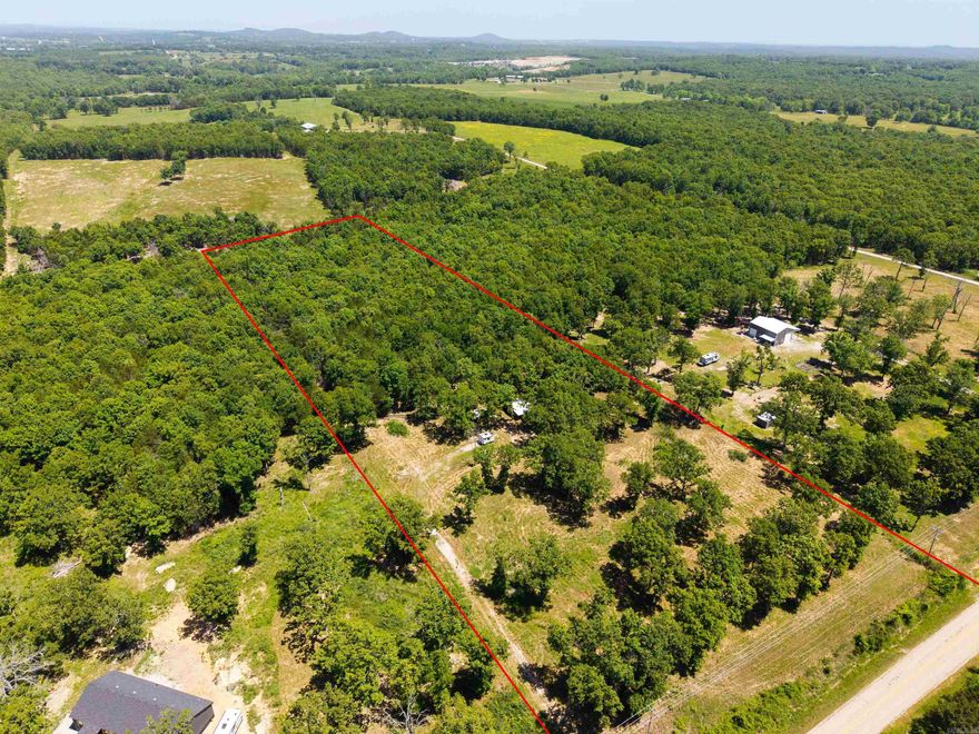 Beautiful acreage featuring open, cleared land at the front of the property with mature woods along the back for added privacy and a peaceful setting. Conveniently located just outside of town and approximately 1.5 miles from the Rim Shoals access on the White River, this unrestricted property is ready for your future home. Improvements already in place include a well, electricity, and a successful perk test approved for a 3-bedroom, 2-bath residence. The property also includes a Dierksen building equipped with water and electricity, plus a welcoming front porch and attached lean-to offering additional storage or workspace.