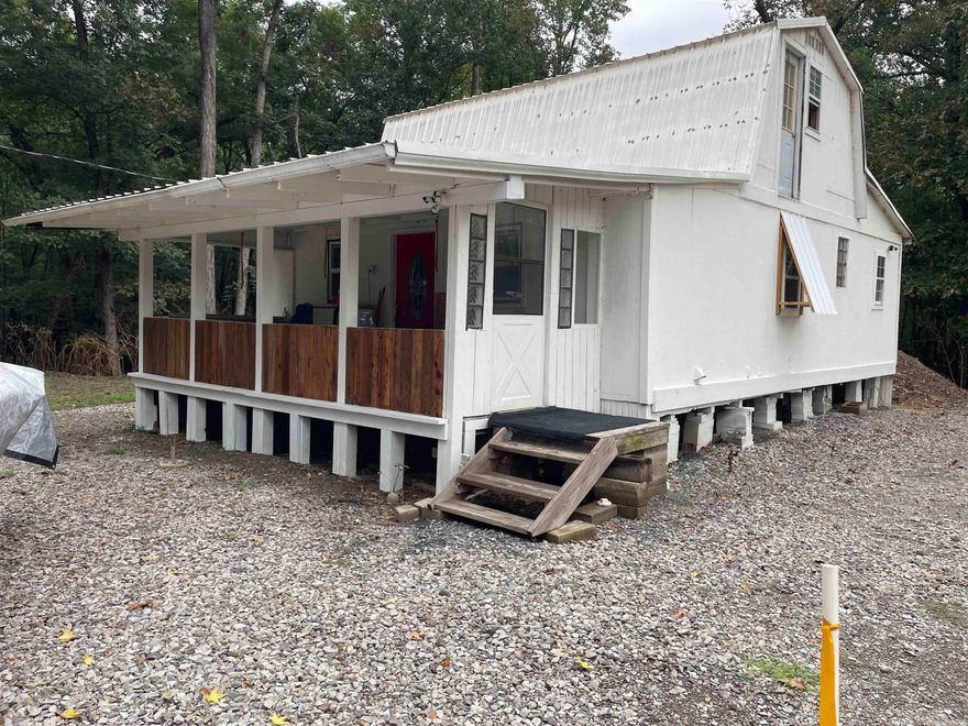 If you're looking for an affordable river retreat, take a look at this! The two cabins are situated on 5 lots in the Nimmo Riverbank Subdivision, just a short walk or ride to the banks of the Little Red River in SE White County. One of the cabins has been a full time residence for the last several years and there are piers ready for you to add on to it to make it even larger for whatever your needs may be. The white cabin is not quite in livable shape (just yet), but it has good bones and is ready for you to make it your own. Thousands of acres of public hunting and fishing land are just minutes away and the Little Red River and White River are right there as well making this a perfect place to make your headquarters for hunting and fishing trips. Both cabins have SEWCO city water, septic systems and the power is provided by Entergy. The sellers use Starlink internet.